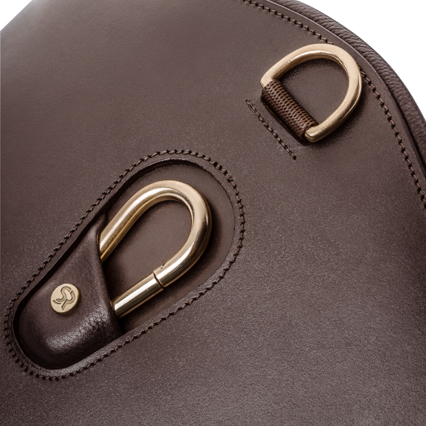 detailed view of hooks and rings ofelastic brown leather stud guard girth hickstead with golden mounting by sunride