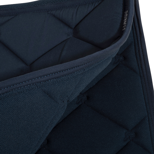 detailed view inside of blue wellington line jumping saddle pad with breathable air mesh spine by sunride