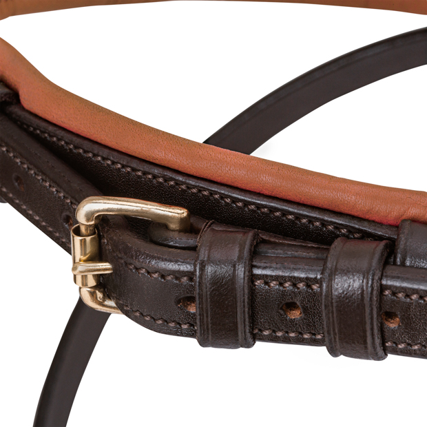 detailed view of padded nose band of brown padded english combined brown leather bridle hawaii with golden mounting including reins