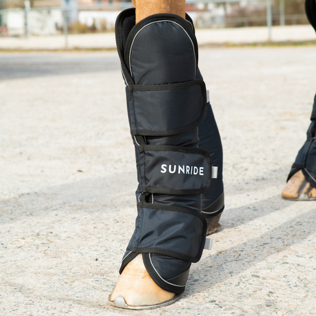 reflecting black frontside travel boots with reinforced hoof area in a set of 2 by sunride on a horse