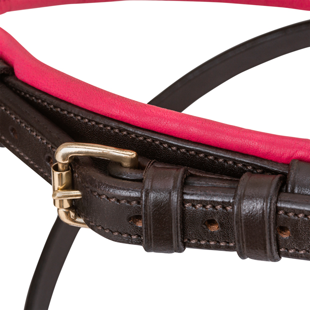 detailed view of padded nose band of pink padded english combined brown leather bridle hawaii with golden mounting including reins