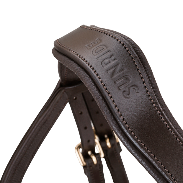 detailed view of shaped neck part of pink padded english combined brown leather bridle hawaii with golden mounting including reins