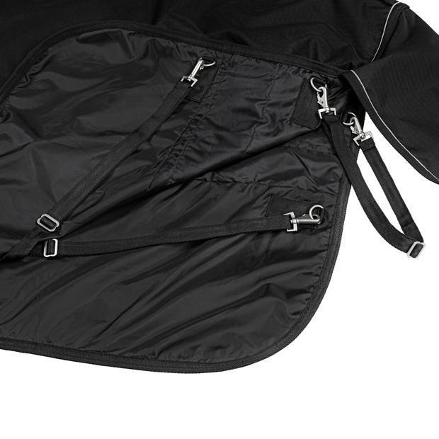 inner lining and connector with straps dublin black reflecting rain rug 50 grams filling detailed view of inner lining and connector clips with straps of black rain rug dublin with 50 grams filling and reflecting elements by sunride
