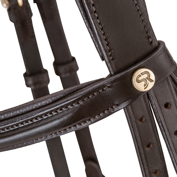 detailed view of pink padded english combined brown leather bridle hawaii with golden mounting including reins