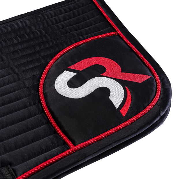 detailed view of sr embroidery on black red sr line jumping saddle pad with breathable air mesh spine by sunride
