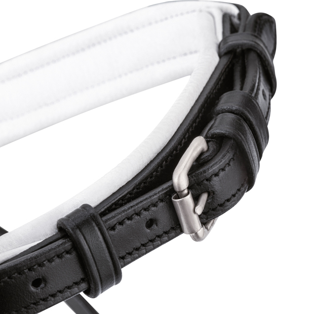 detailed view of padded nose band of white padded english combined black leather bridle hawaii with silver mounting including reins