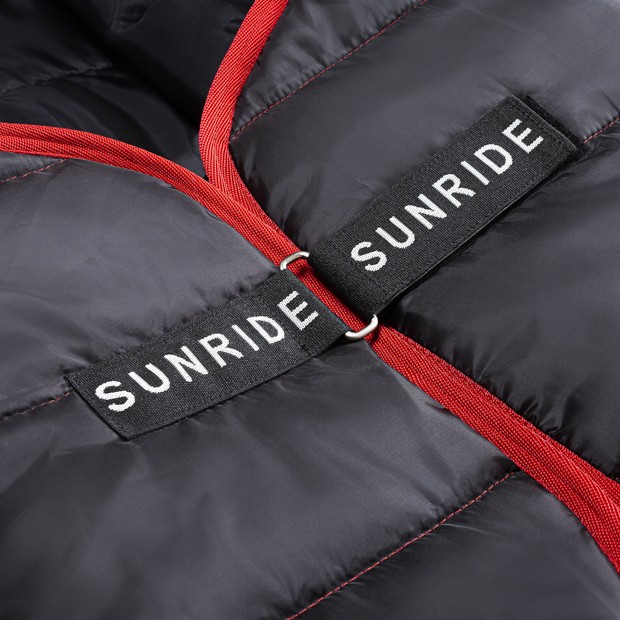 detailed view of velcro front closure on black under rug with 300 grams filling compatible with all sunride winter and rain rugs