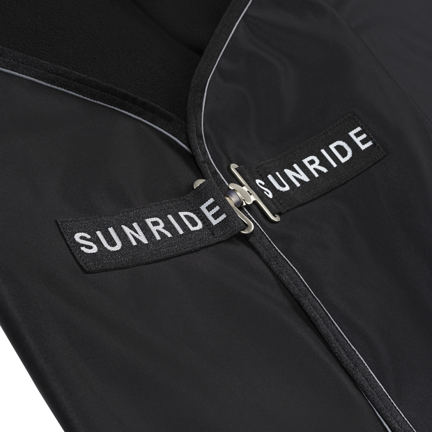 black boston cooler rug made of softshell and fleece with detailed view of front closure by sunride