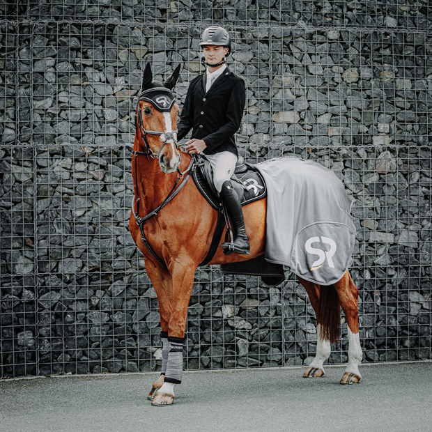 exclusive line set of grey cooler rug with matching saddlepad, earnet and bandages by sunride