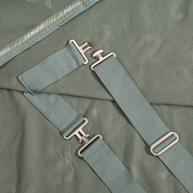 belly straps of wellington cooler rug with removable belly straps olive detailed view of belly straps adjustment of olive cooler rug with removable belly straps wellington line by sunride
