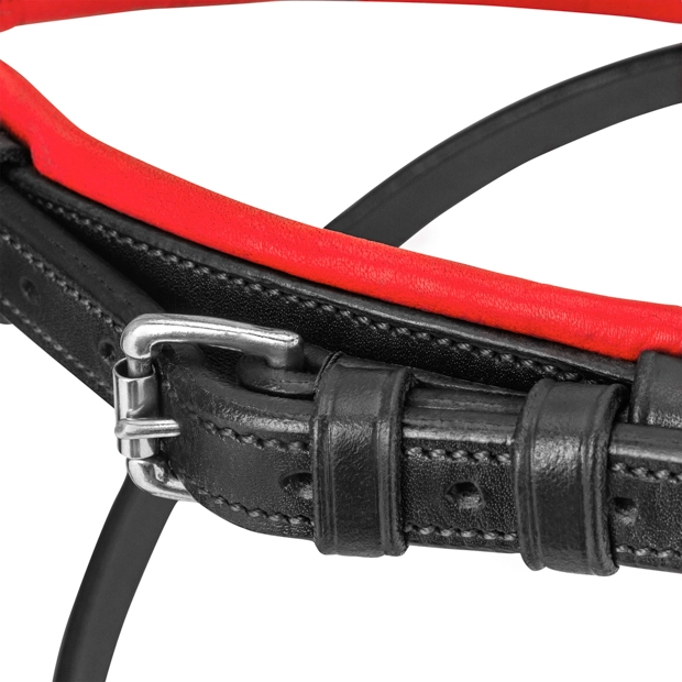 detailed view of padded nose band of red padded english combined black leather bridle hawaii with silver mounting including reins