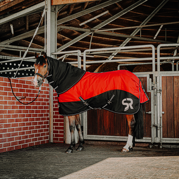 black neck part attached to red helsinki winter rug on a horse