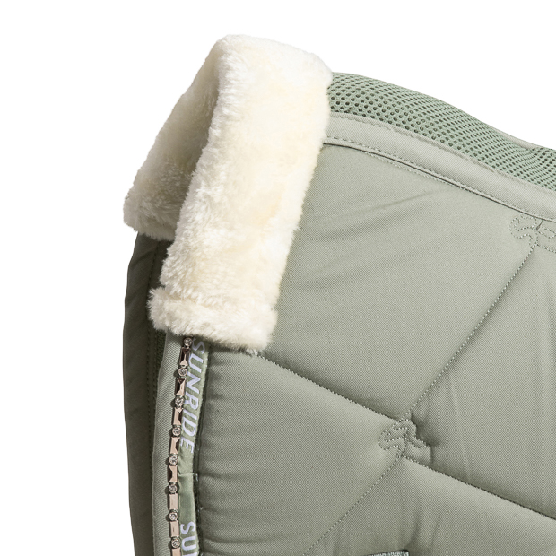 detailed view of fur on breathable dressage saddle pad wellington olive with  gemstones and fur on withers